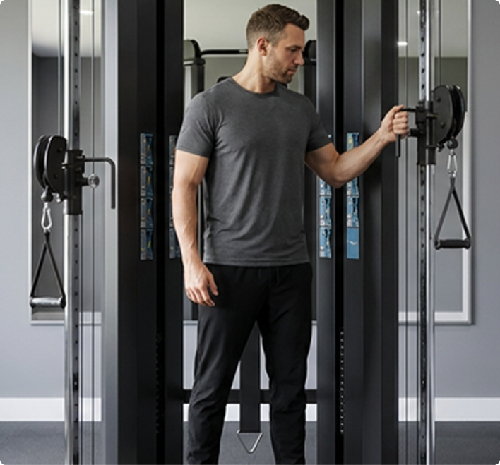 Man using the Vision Fitness 300-FT Functional Trainer in a home gym