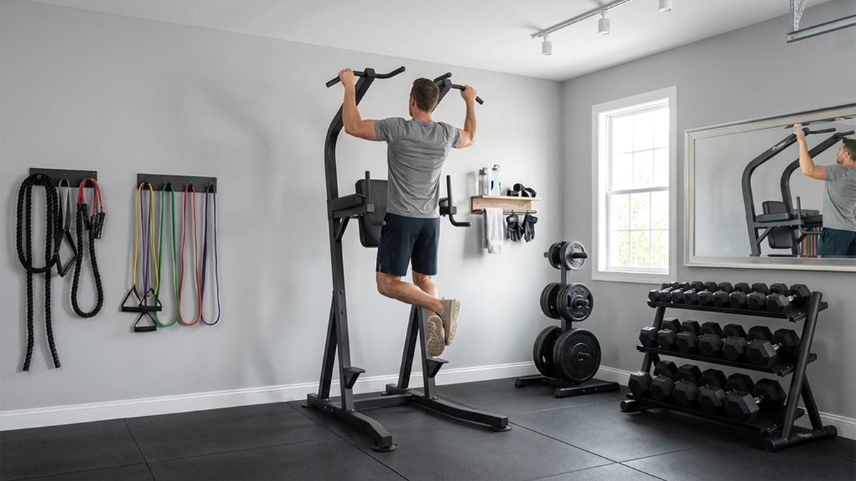 Man using the Vision Fitness 300-VKR Vertical Knee Raise in a home gym