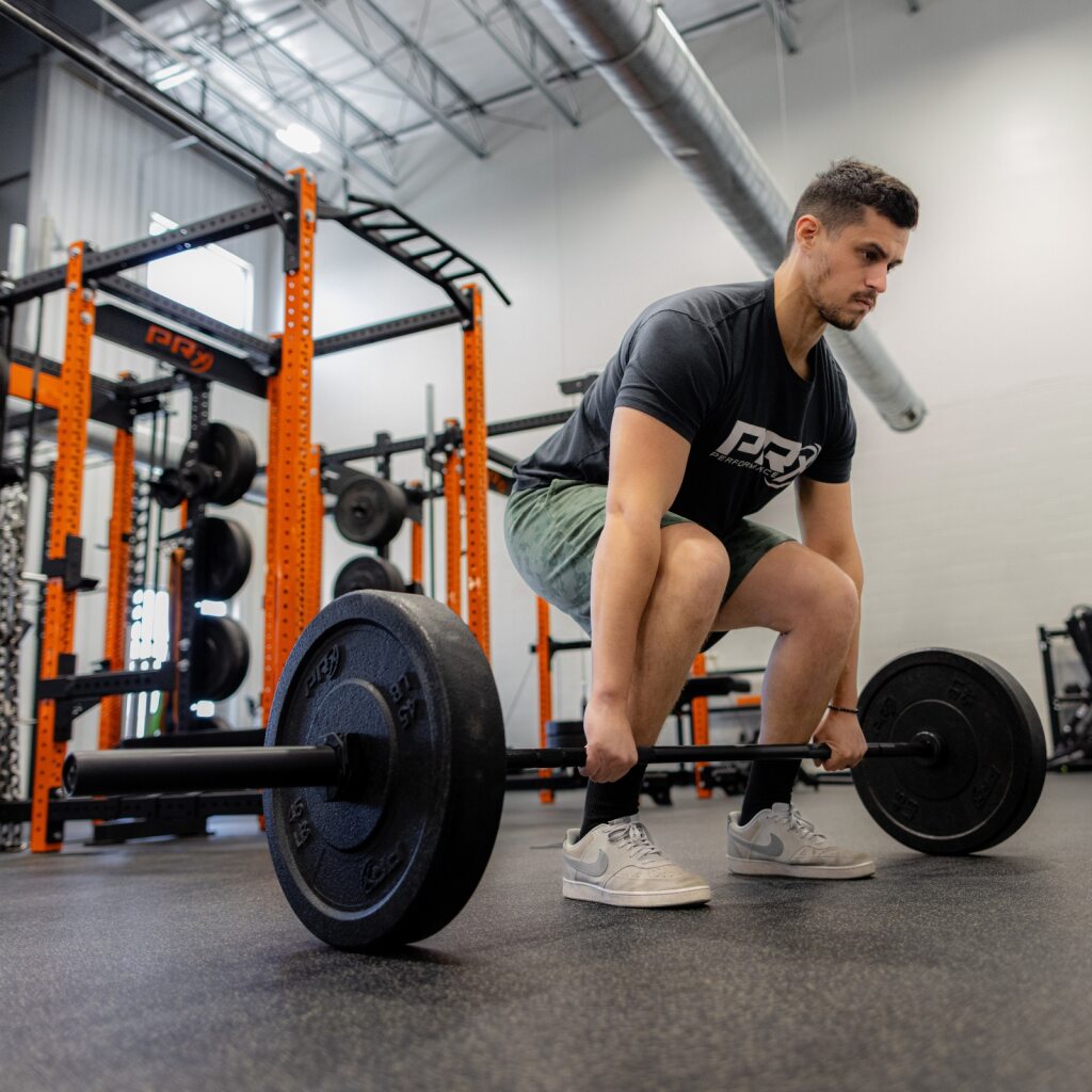 Lifter training with the PRx Thresher Barbell