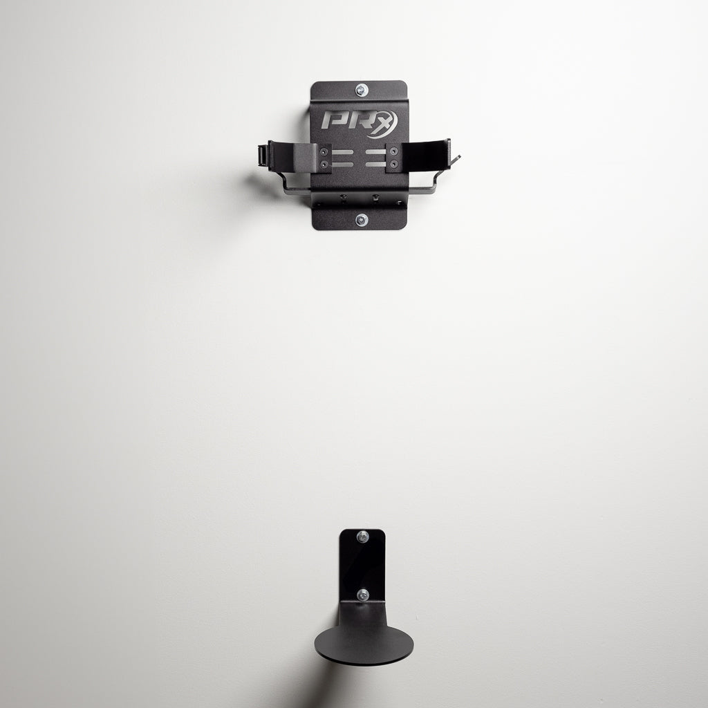 Golf bag hanging off the floor on the PRx wall-mounted storage in a garage