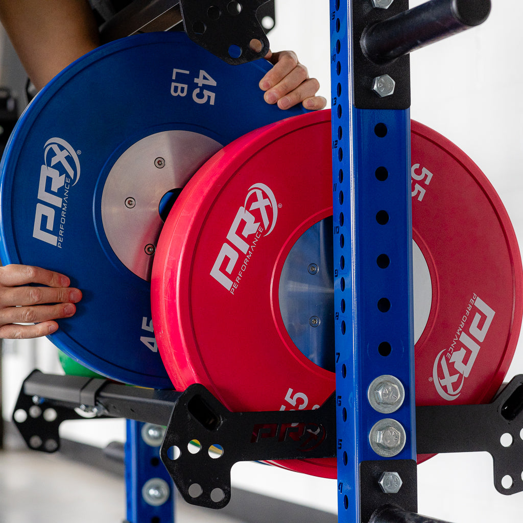 Olympic bumper plates stored on the Build Limitless Plate Shelf