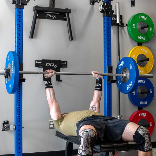 Lifter deadlifting with the PRx Stainless Thresher Bar