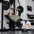 PRx Stealth Weight Bench in a home gym next to a rack