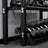 Flat shelf plates holding dumbbells on the PRx Build Limitless storage unit