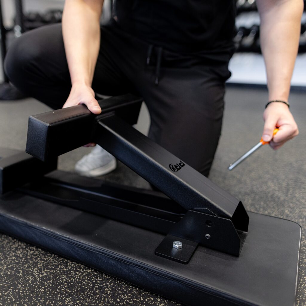 PRx Compact Flat Weight Bench folding leg and locking pin detail