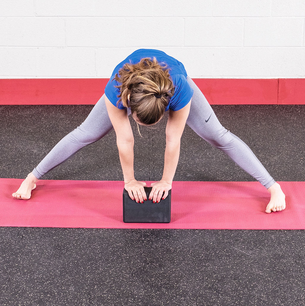 Body-Solid Tools Yoga Block - in use, wide-leg stretch