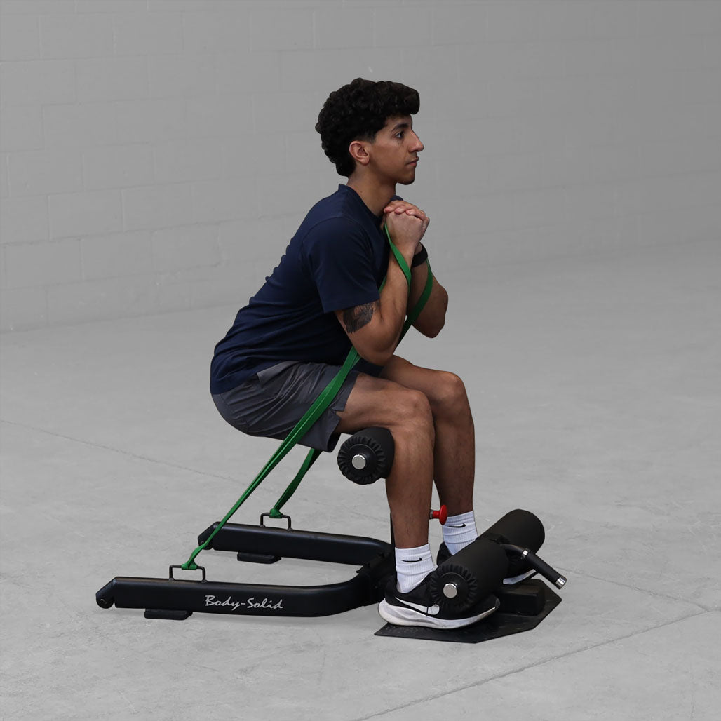 Body-Solid Sissy Squat - in use, banded exercise