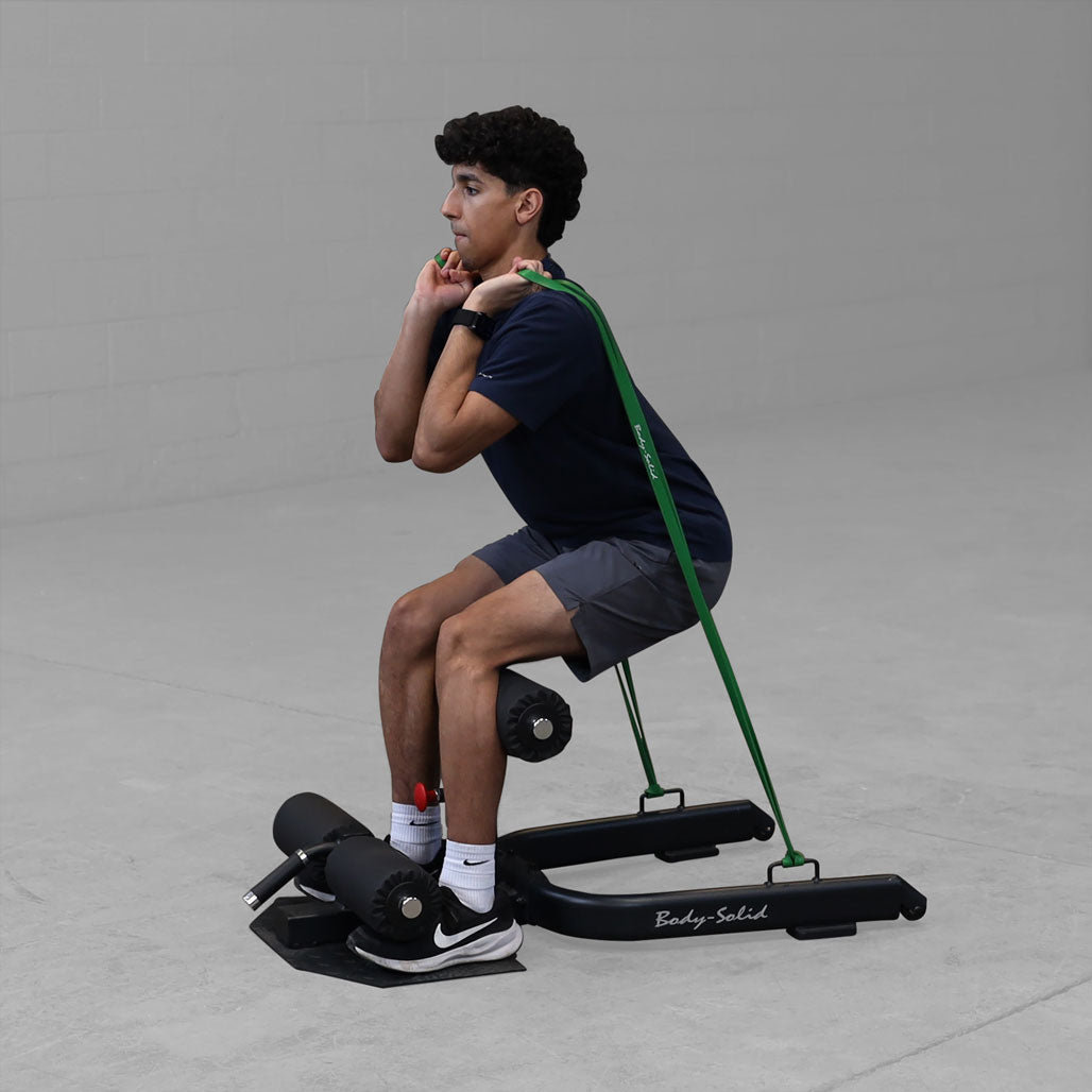 Body-Solid Sissy Squat - in use, banded squat