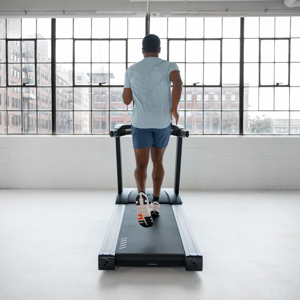 Runner using the True Fitness Launch treadmill