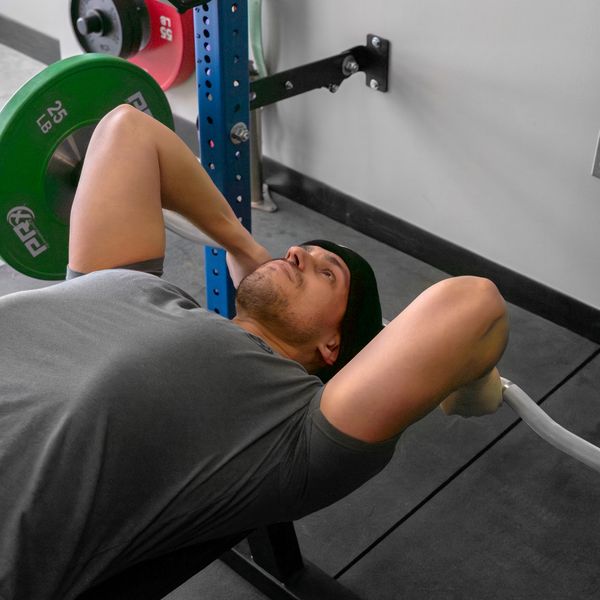 PRx Hammerhead Rackable Curl Bar loaded with plates
