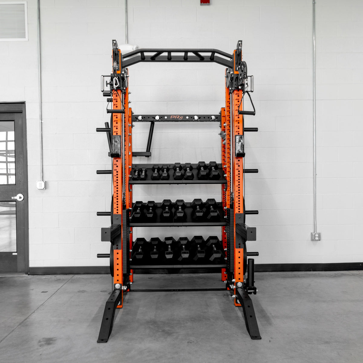 Weight plate storage pegs and barbell storage on the Trident Rig