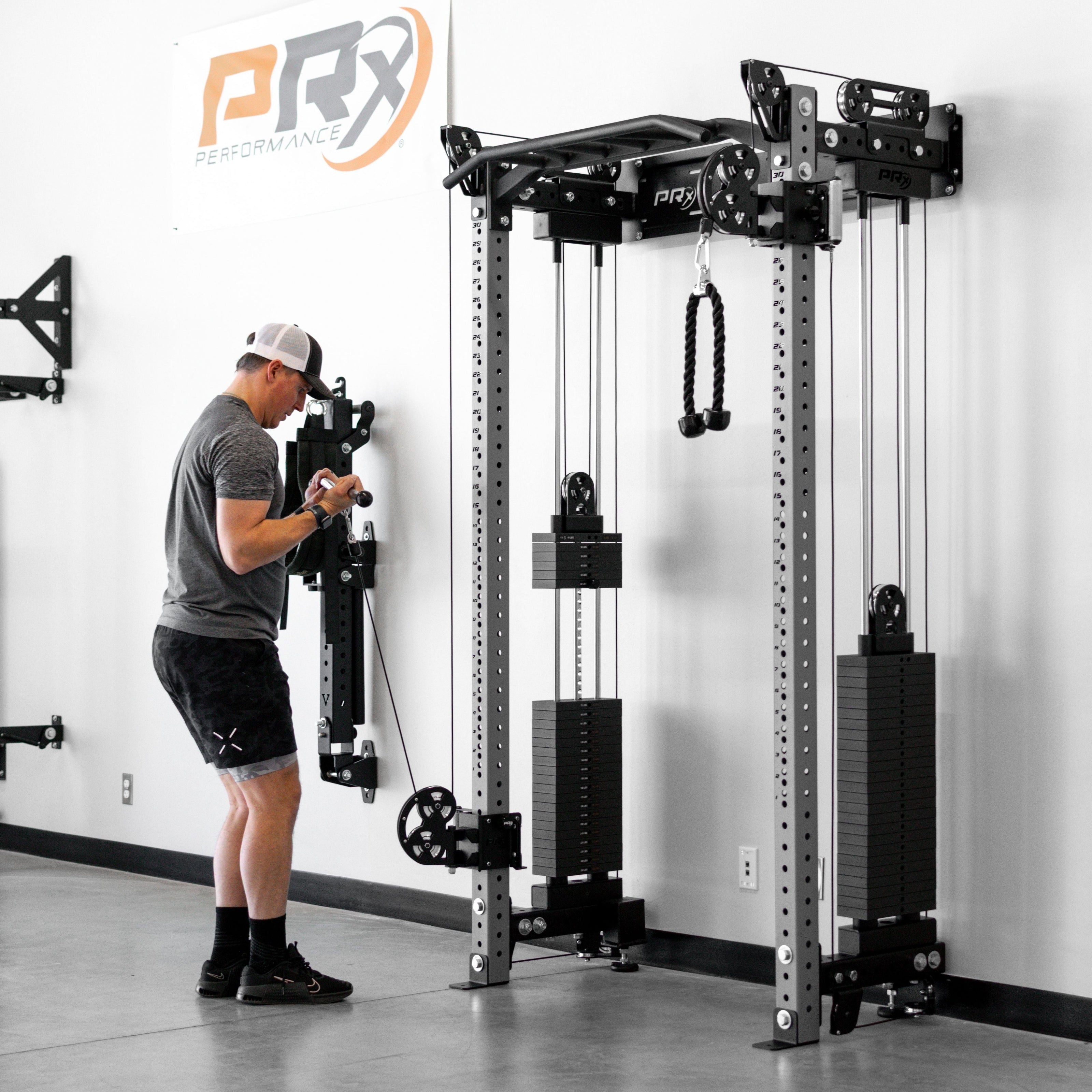 Wall mounted functional trainer showing the shallow depth against the wall