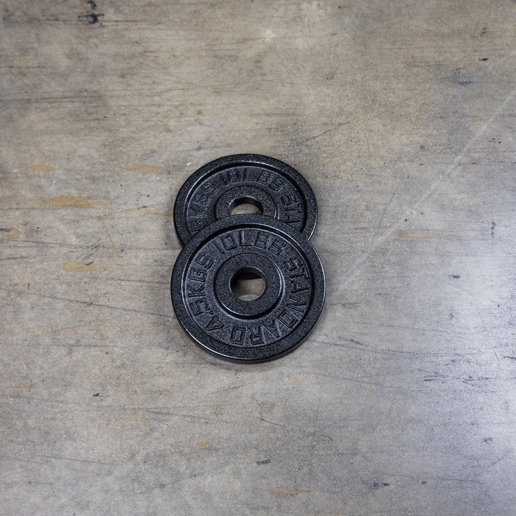 PRx cast iron Olympic plates in multiple sizes side by side
