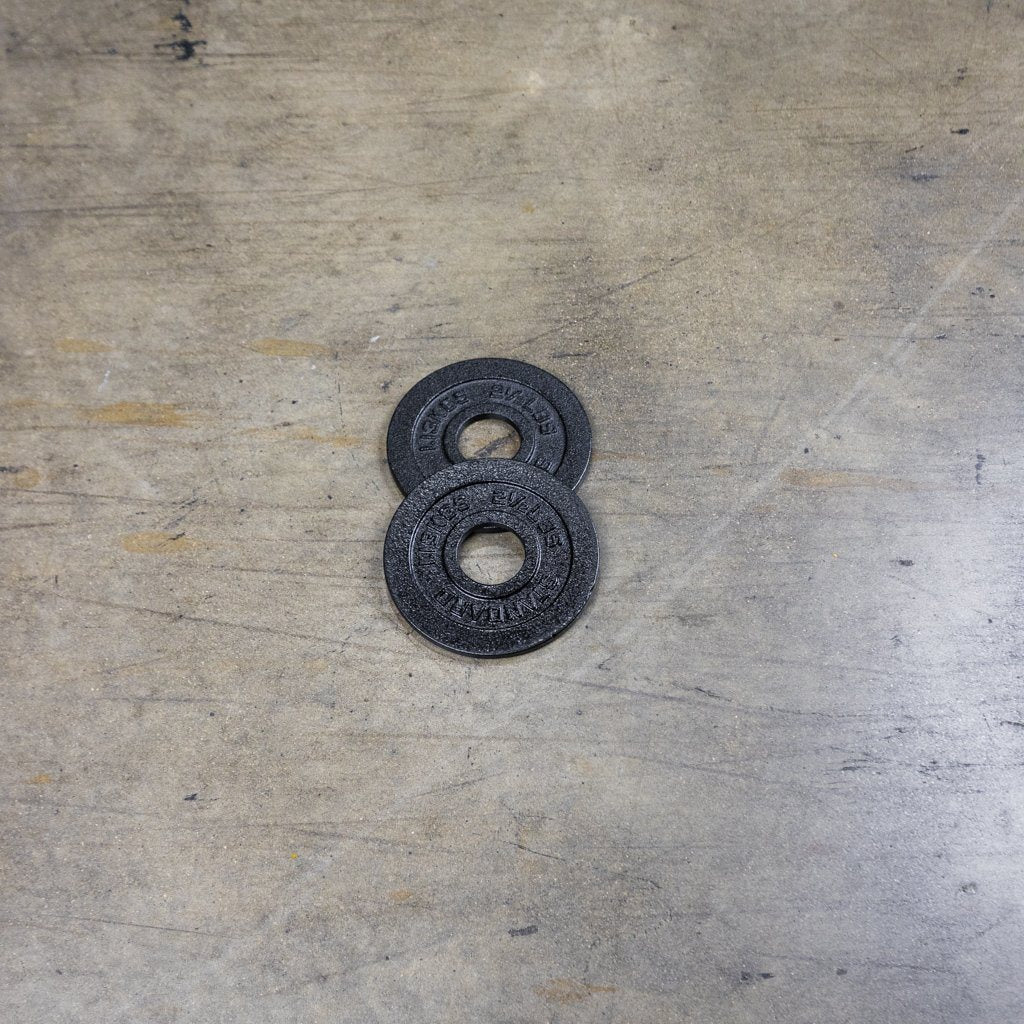 PRx cast iron Olympic plates loaded on a barbell