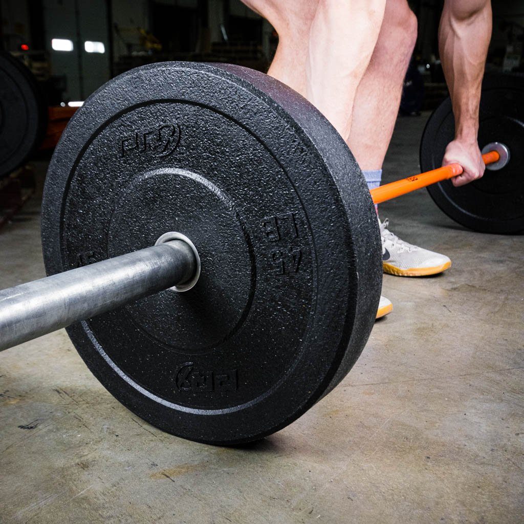 PRx Crumb Rubber Bumper Plates in a home gym setup