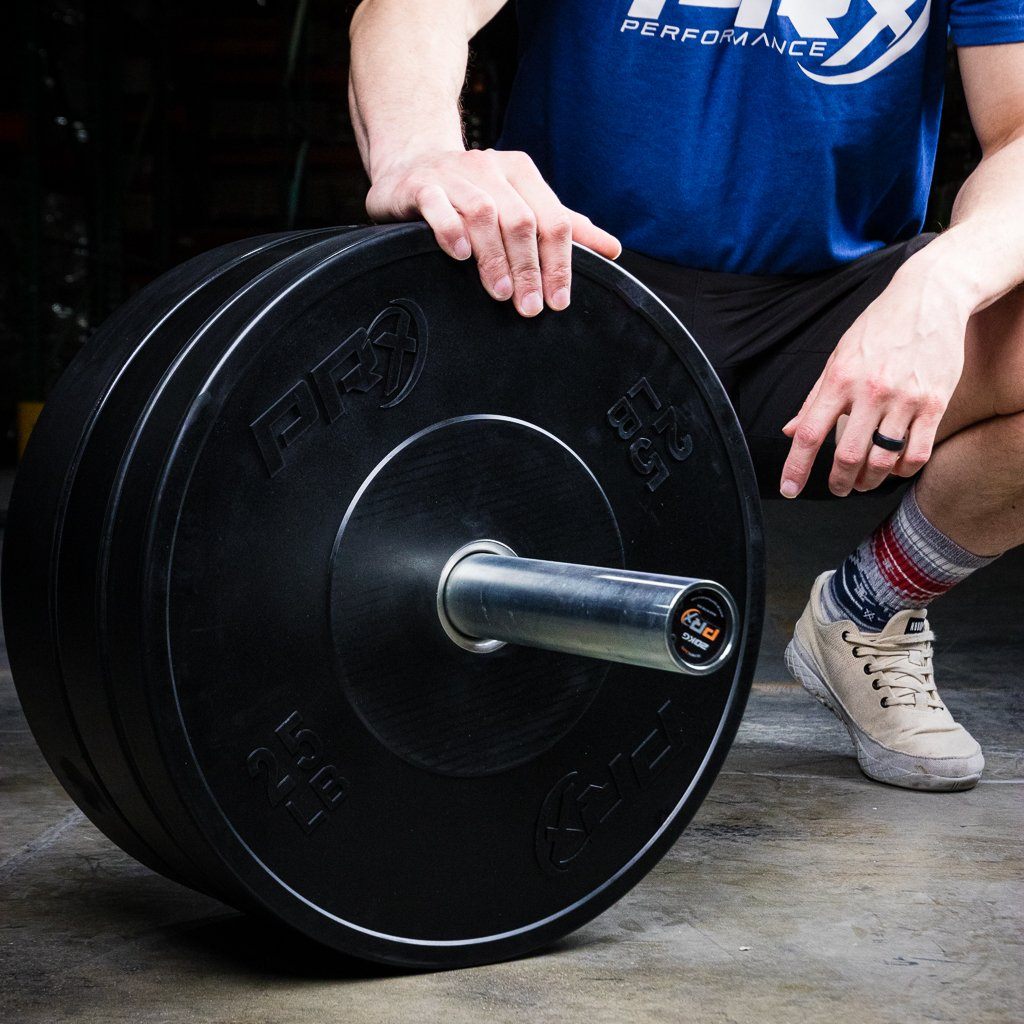 PRx Prime Bumper Plates set in a home gym setting