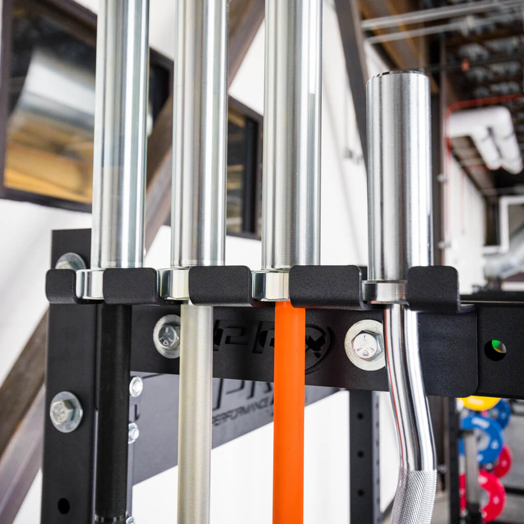 Close view of the black powder coated barbell slot on the PRx rack mount bar hanger