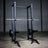 Bumper plates stacked on Build Limitless storage pegs in a home gym