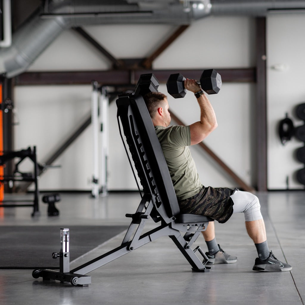 PRx Stealth Weight Bench stored upright against a wall