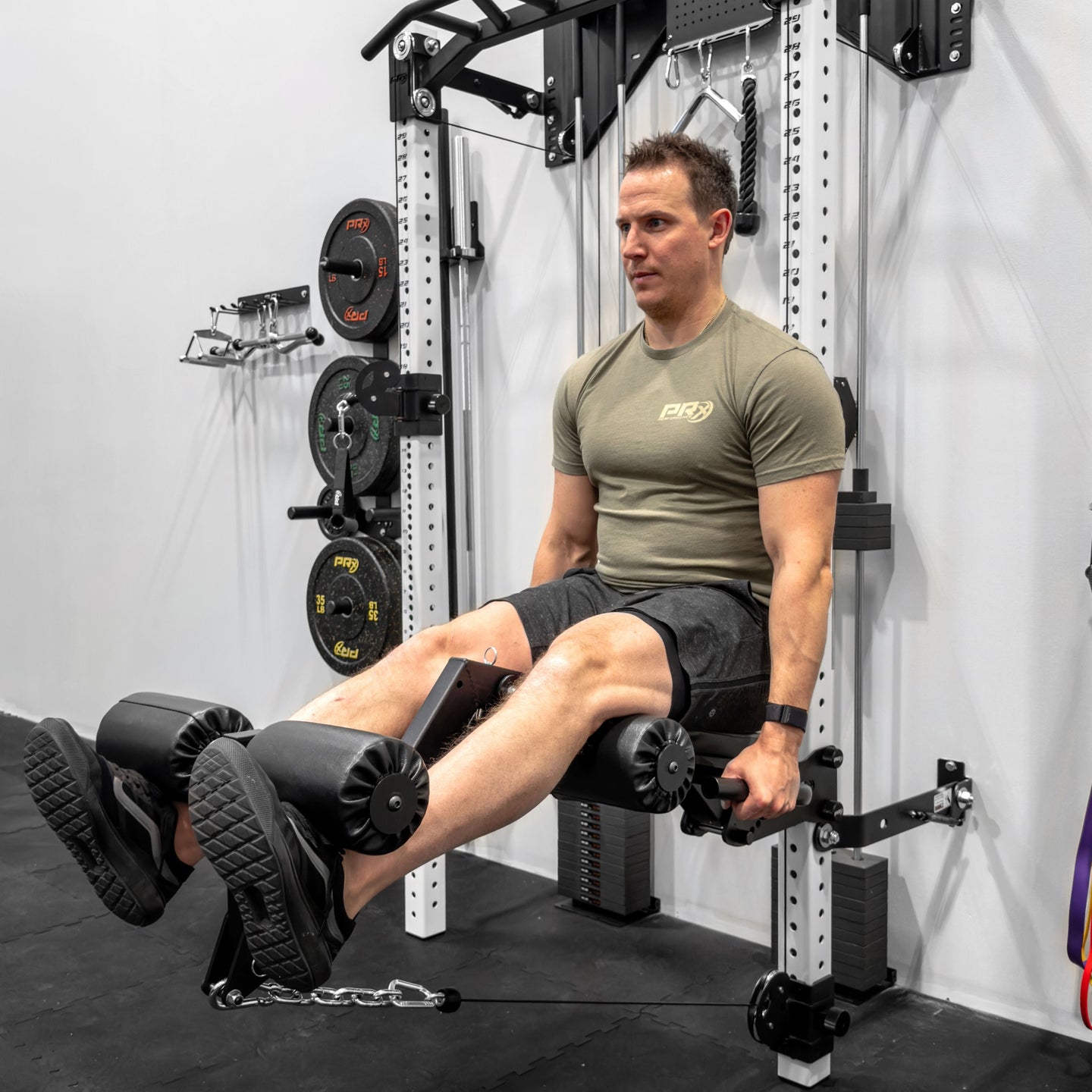 Athlete performing a seated leg extension on the PRx attachment