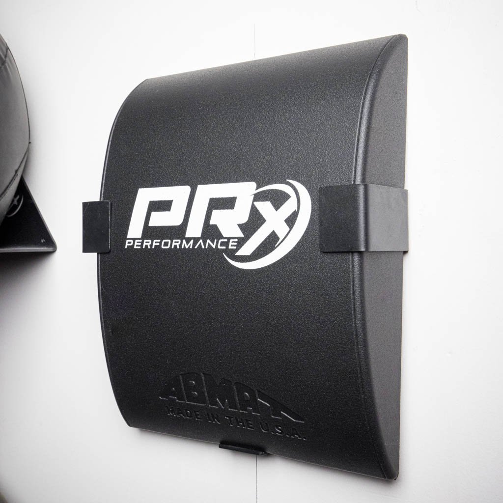 PRx AbMat Storage installed on a home gym wall