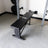 PRx Profile Flat Folding Bench folded against the wall