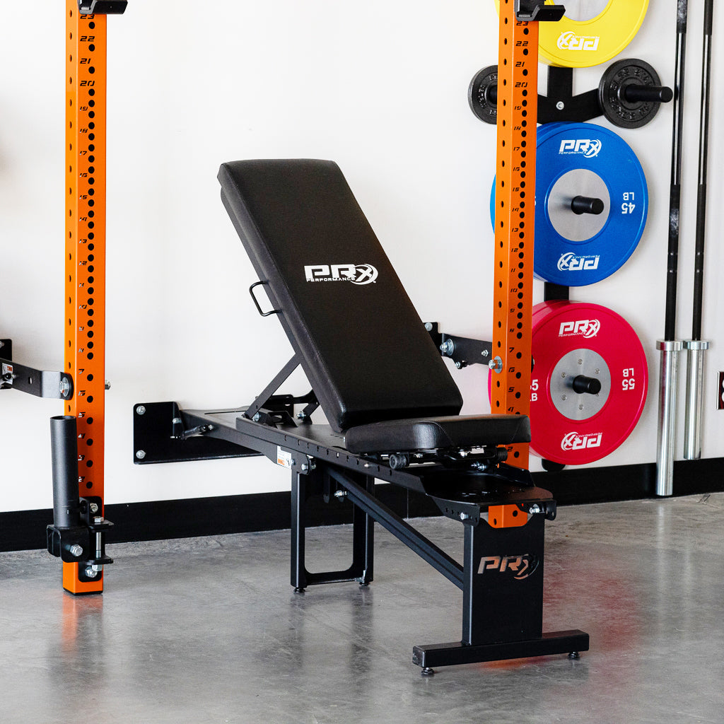 PRx Profile Incline Folding Bench folded flat against the wall