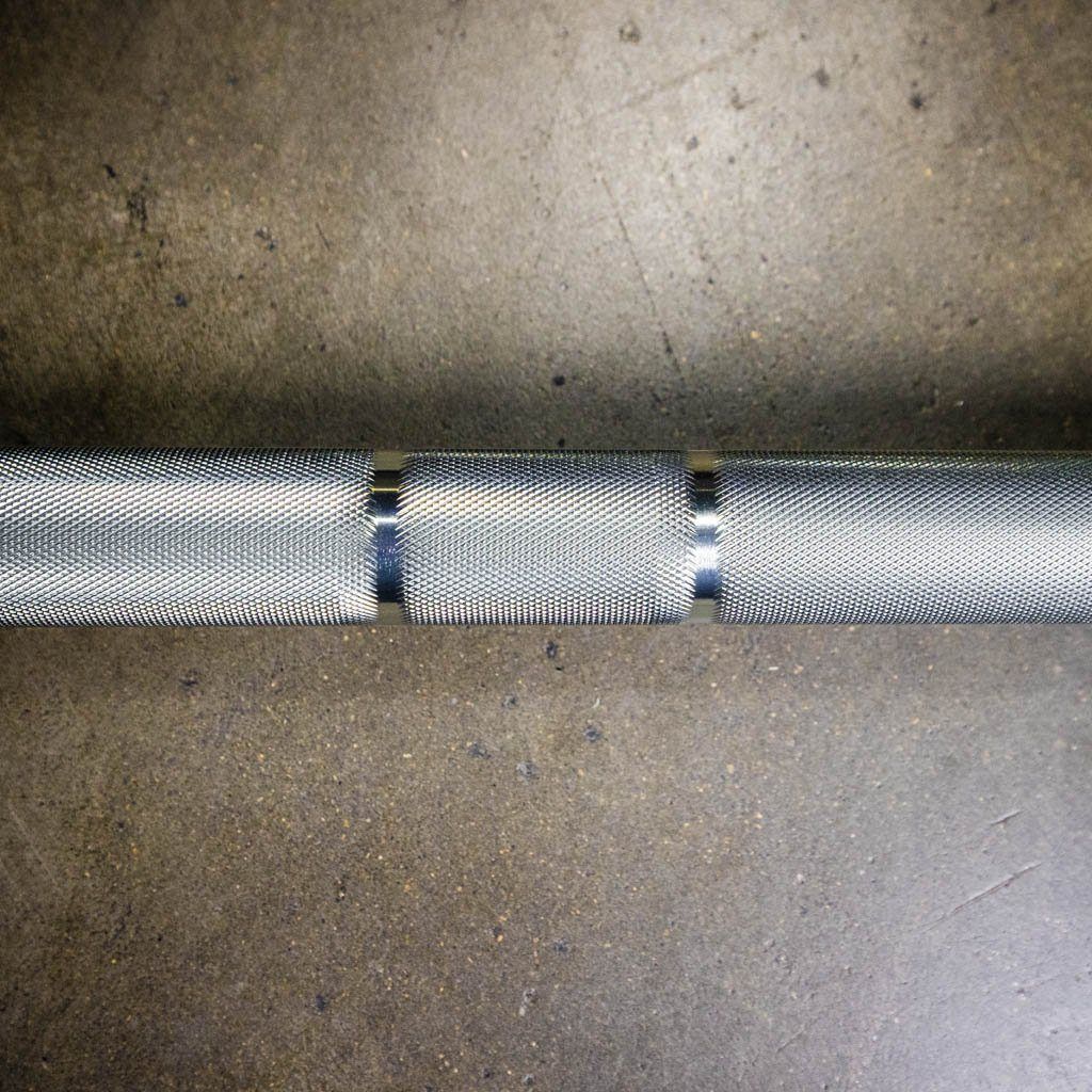PRx Olympic Elite Barbell in a squat rack