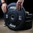 PRx Color Fleck Bumper Plates stored on a wall mounted plate rack