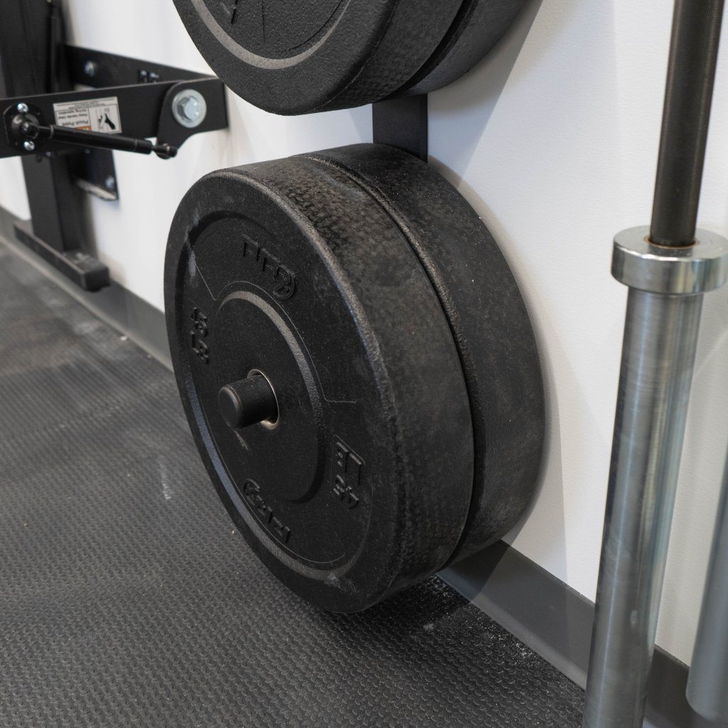 Close view of a PRx weight plate storage peg holding bumper plates