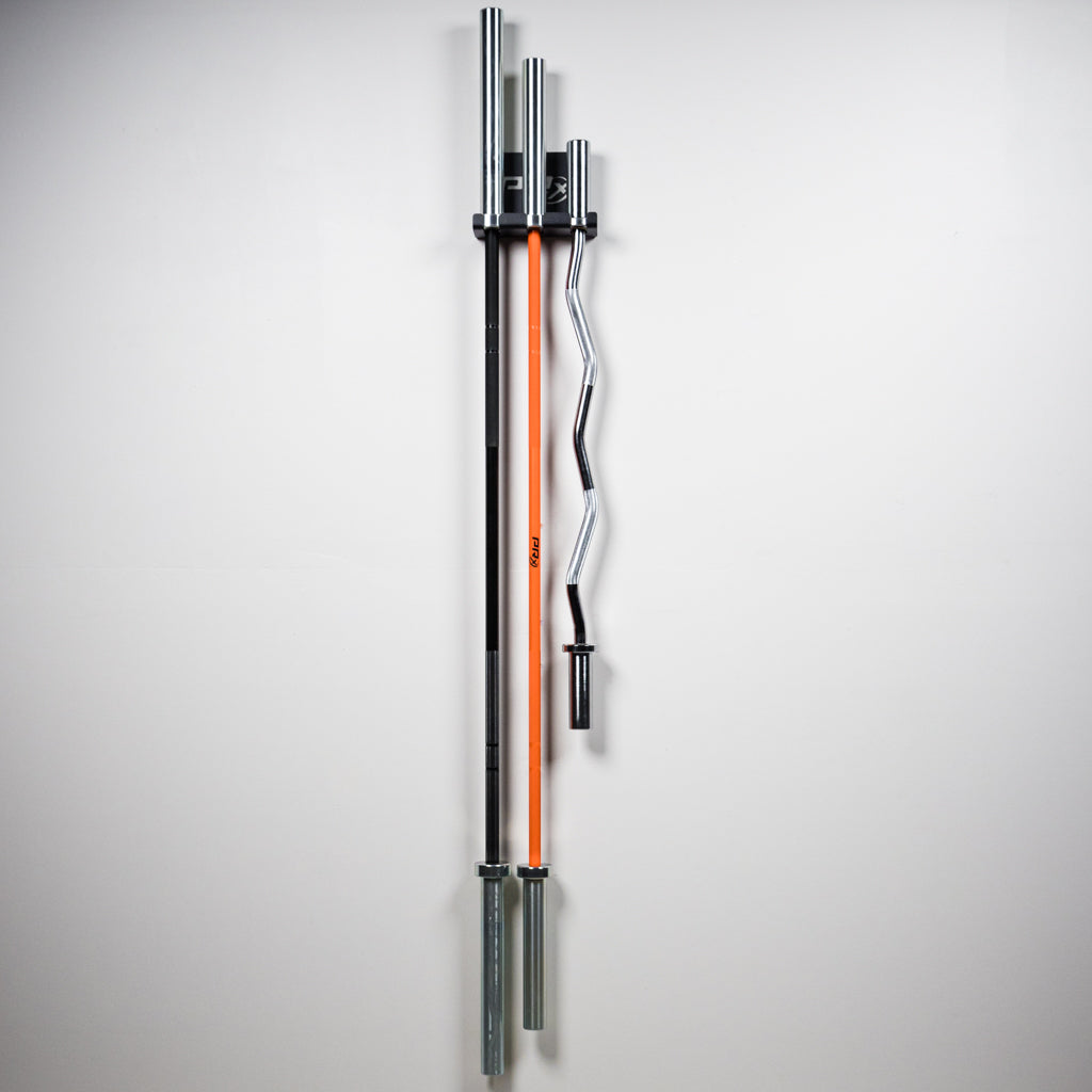 Barbell sleeve resting in the 1.25 inch slot of a PRx hanging bar storage unit