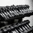 PRx wall-mount dumbbell shelf mounted at an angle with dumbbells loaded