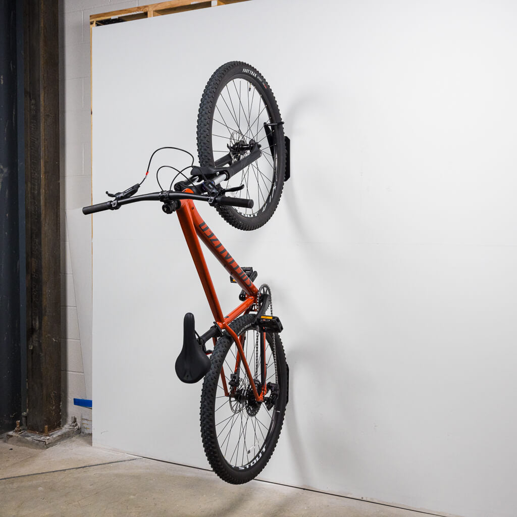 PRx Single Bike Storage steel hanger mounted to a garage wall